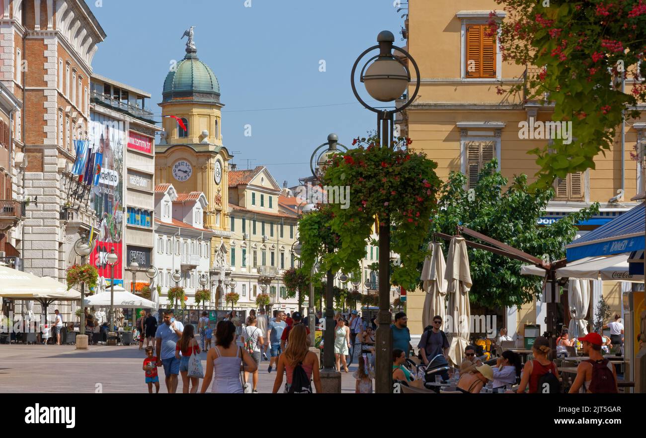 RIJEKA, Croatia - August 7, 2022: Korzo, the lively elegant commercial street in the city center, full of shops and cafes,. crowded with tourists in m Stock Photo