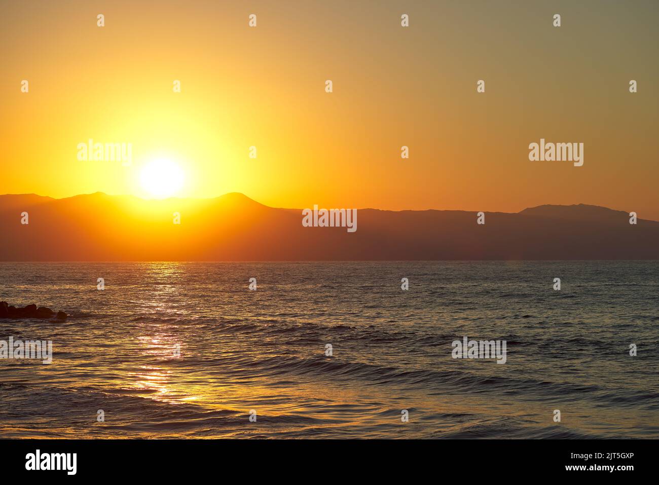 Beautiful sea and waves at sunset time in Chania Crete - Greece Stock Photo