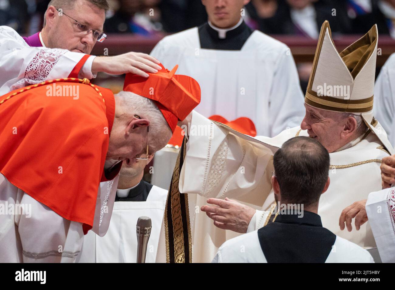 Vatican, Vatican. 27th Aug, 2022. New Cardinal Fernando Vérgez Alzaga receives the red three-cornered biretta hat from Pope Francis during the Consistory to create 20 new cardinals at St. Peter's Basilica. Credit: SOPA Images Limited/Alamy Live News Stock Photo