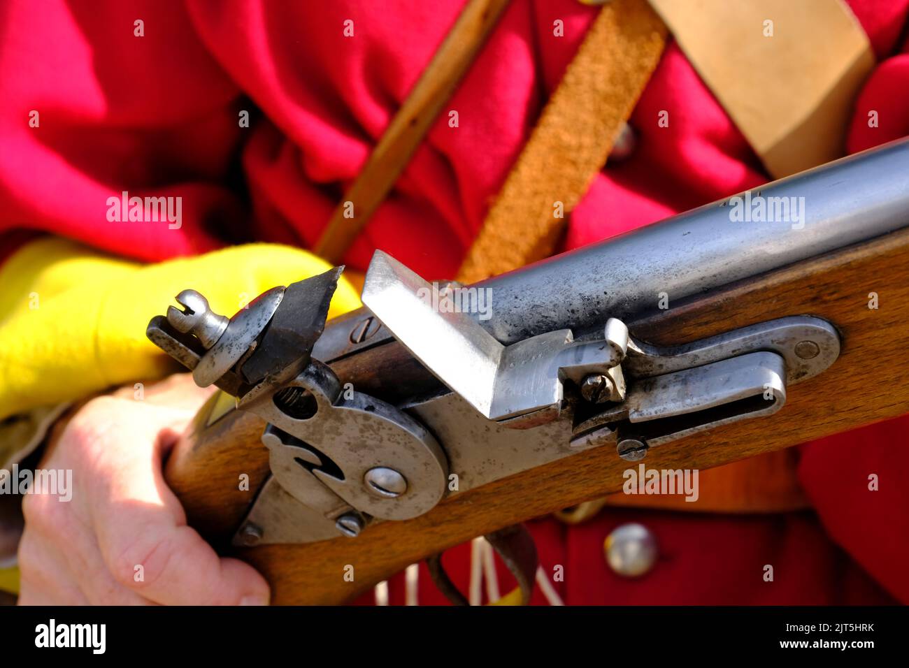 Glastonbury, UK. 28th Aug, 2020. Members of the Taunton Garrison re-enact the 1785 Monmouth Rebellion at Glastonbury Abbey. Taunton Garrison are enthusiasts who provide living history and military demonstrations. An authentic flintlok. Credit: JMF News/ Alamy Live News Stock Photo