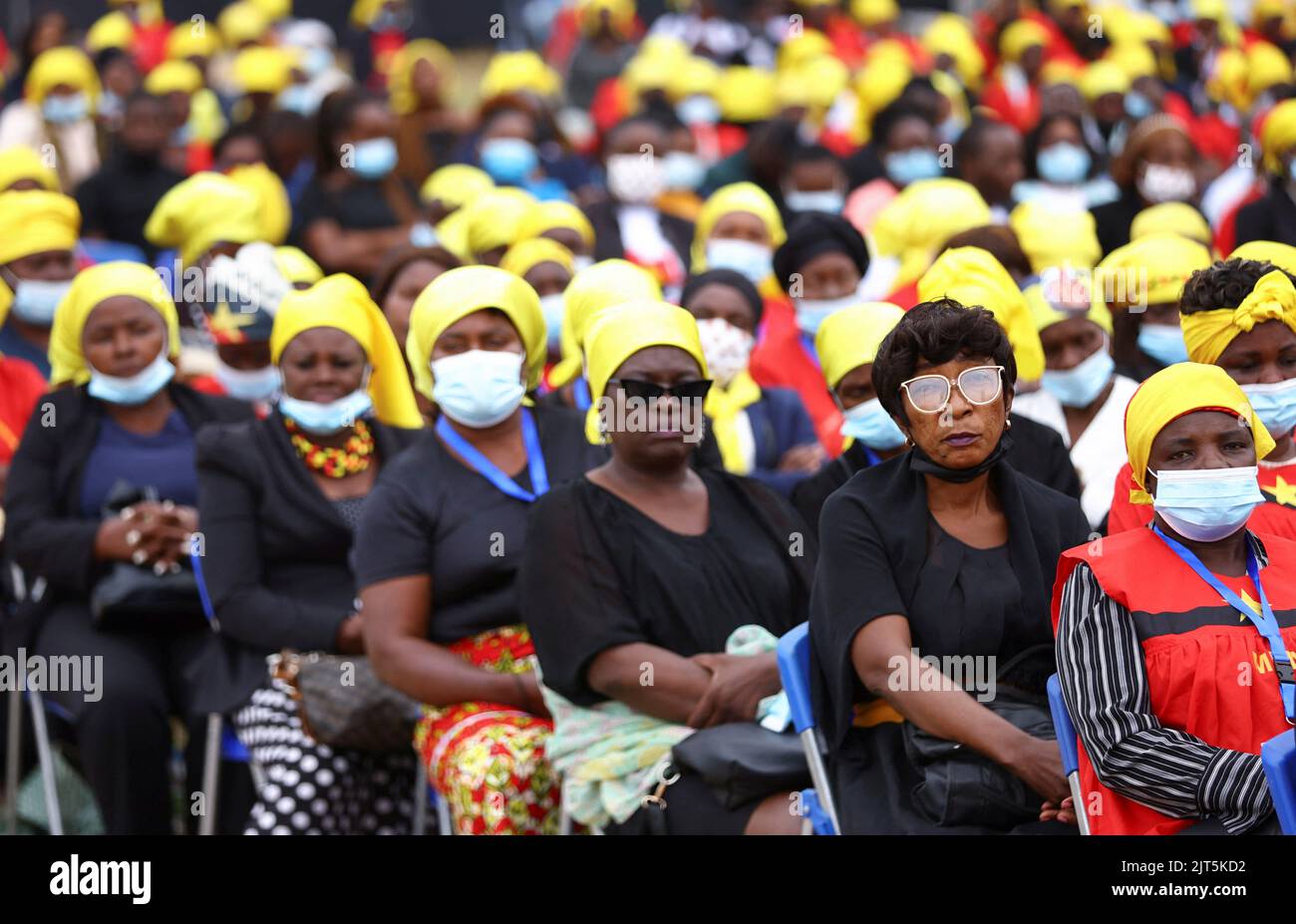 Angolans look on as they gather for the funeral of Angola's former President Jose Eduardo dos Santos, who died in Spain in July, at the Agostinho Neto Memorial, in Luanda, Angola, August 28, 2022. REUTERS/Siphiwe Sibeko Stock Photo