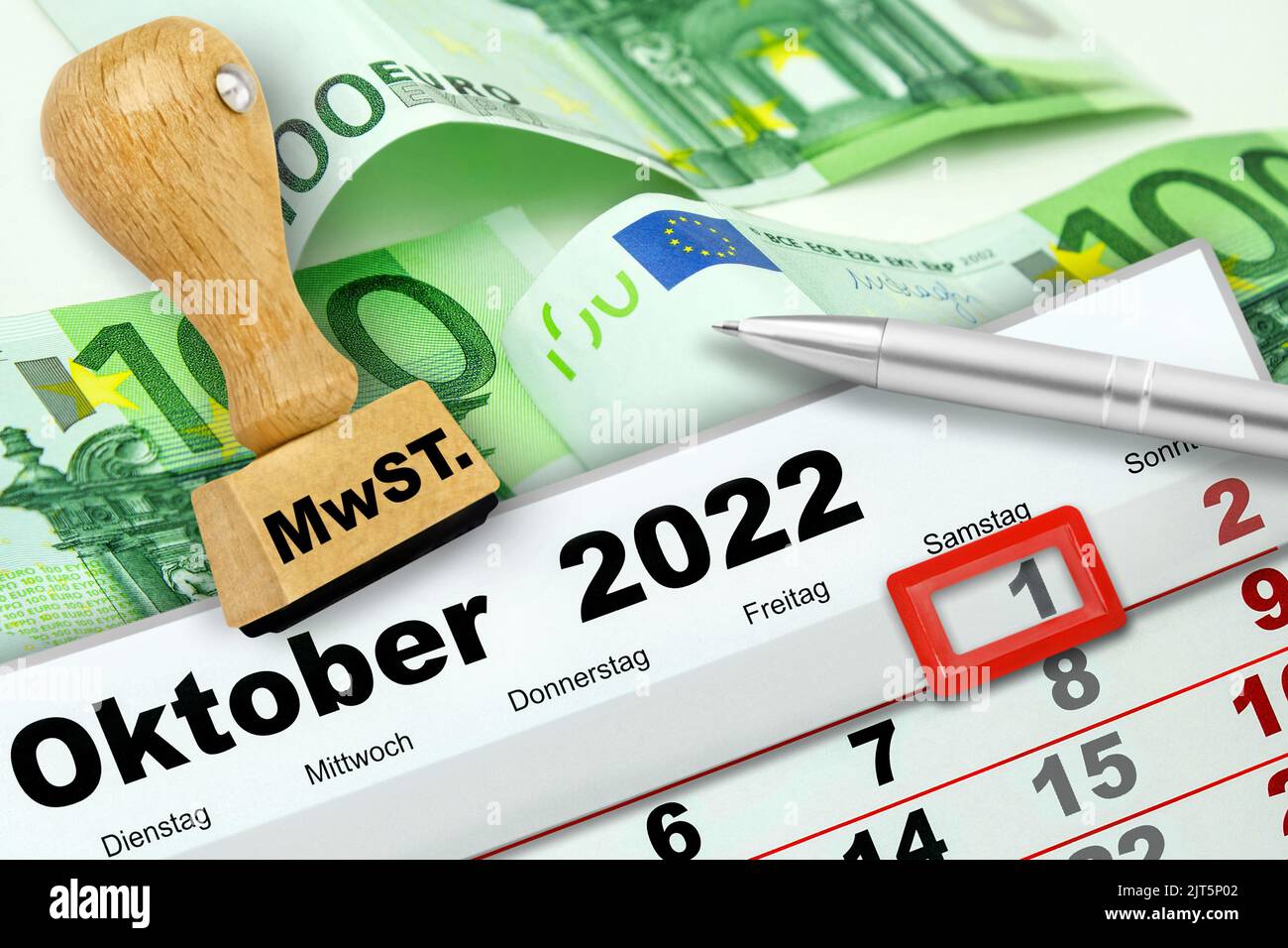 German calendar 2022 October 1  Saturday and Euro banknotes with stamp and value added tax Stock Photo