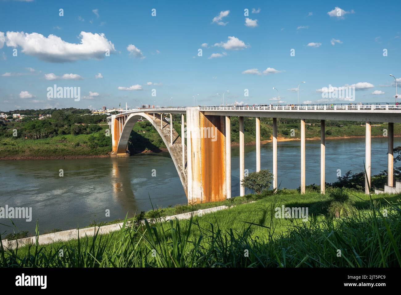 Friendship Bridge (Portuguese: Ponte da Amizade ) over the Parana river, connecting Foz do Iguacu, Brazil, to Ciudad del Este in Paraguay. Stock Photo