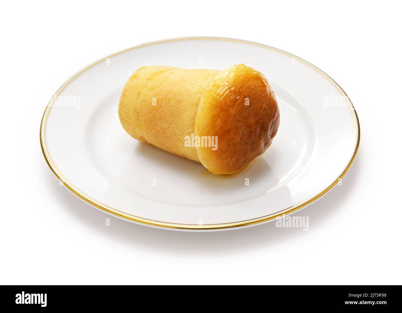 rum baba ( baba au rhum ), traditional French and Italian dessert isolated on white background Stock Photo