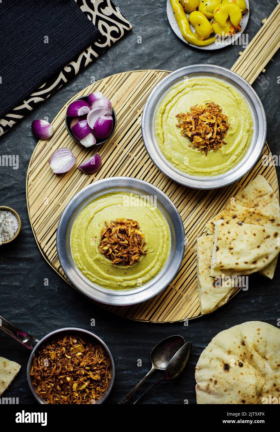 Arabic cuisine, Egyptian fava beans and herbs dip ( Bessara). It contains fava beans, onion, garlic and fresh herbs. Stock Photo