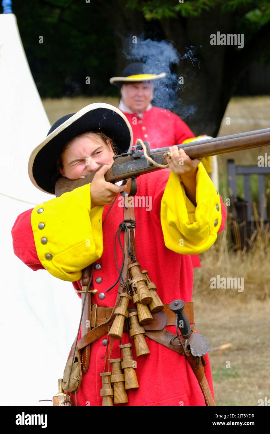 Glastonbury, UK. 28th Aug, 2020. Firing a match lock musket. Members of the Taunton Garrison re-enact the 1785 Monmouth Rebellion at Glastonbury Abbey. Taunton Garrison are enthusiasts who provide living history and military demonstrations. Credit: JMF News/ Alamy Live News Stock Photo