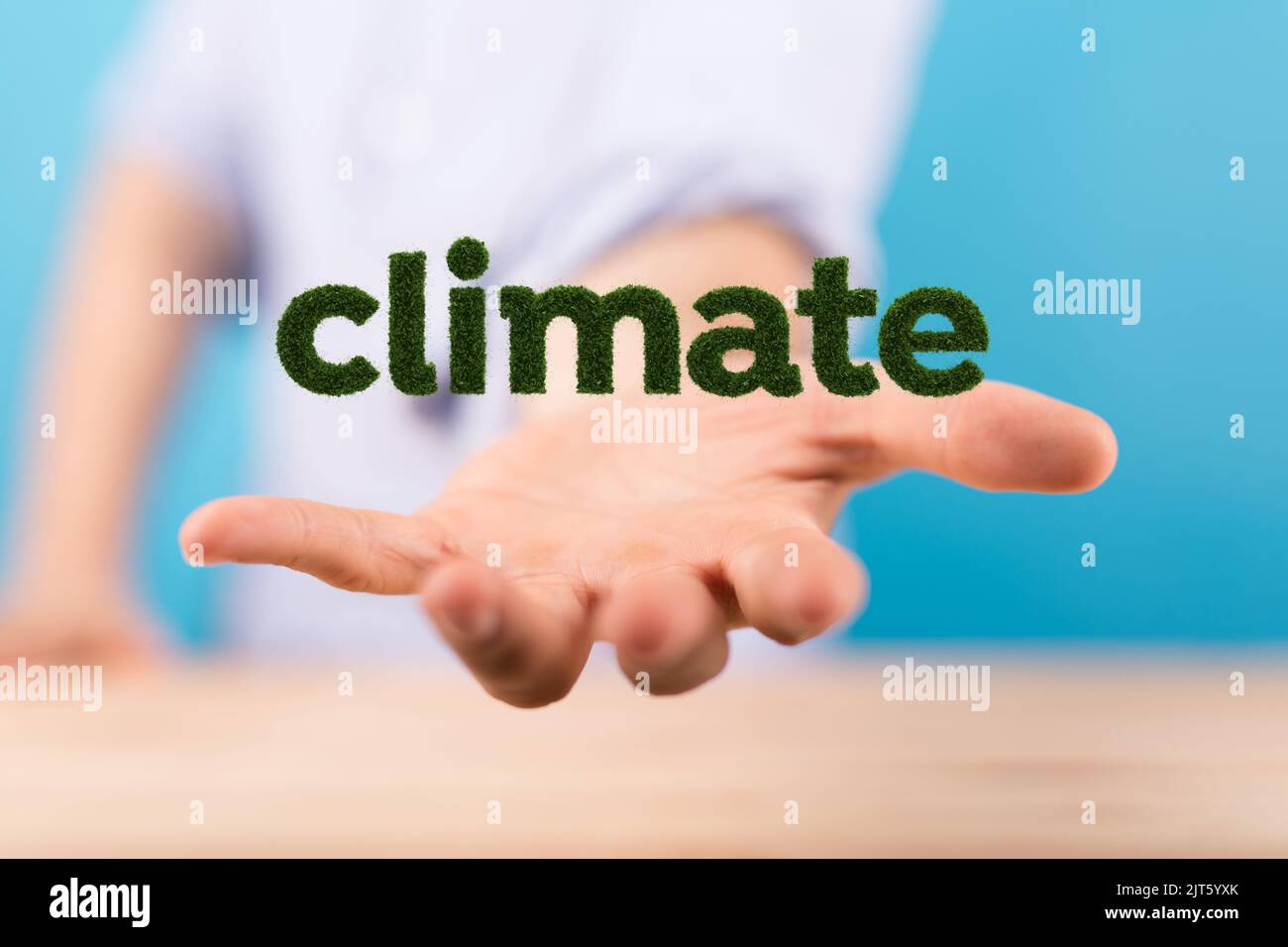 A 3D rendered climate text hovering in mans hand Stock Photo - Alamy