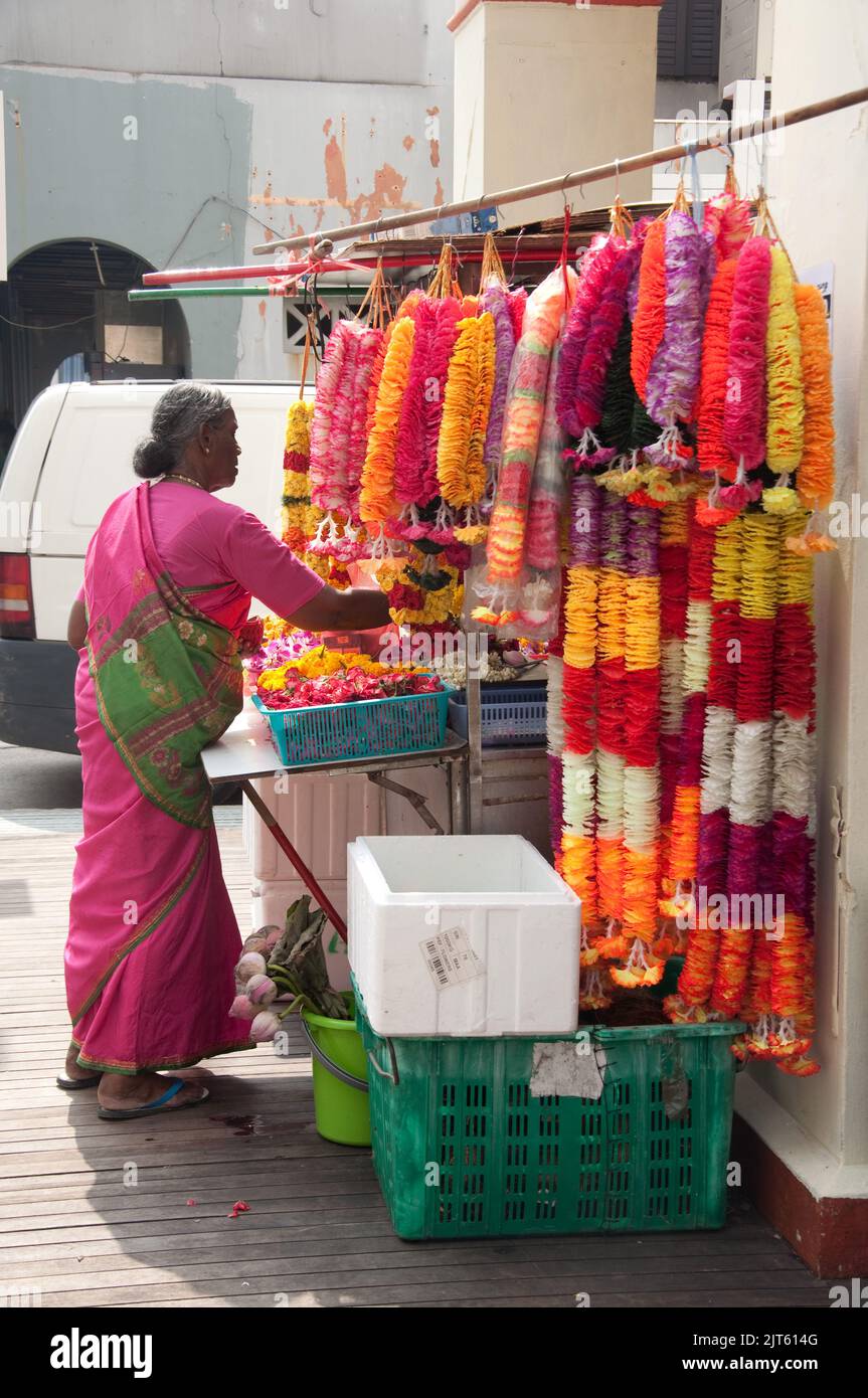 Woman buying decorations at stall with Deepavaili Decorations, Little India, Singpapore Stock Photo