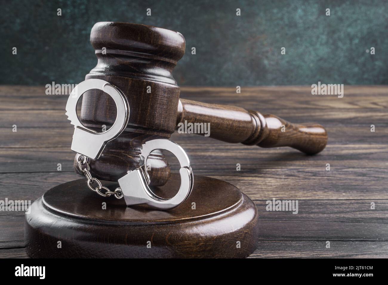 Law gavel with handcuff close-up. Arrest concept Stock Photo
