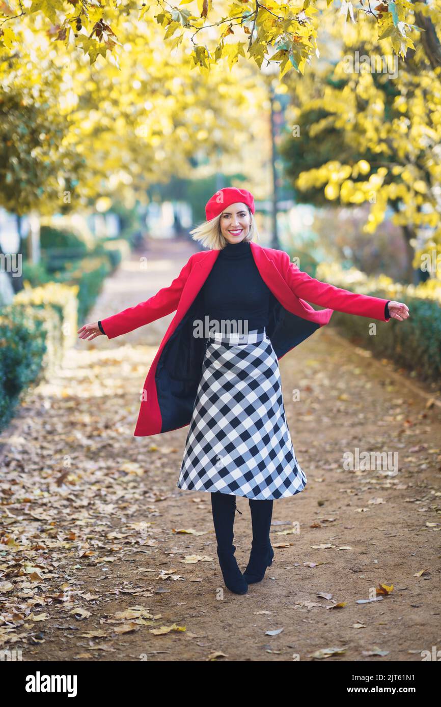 Happy woman spinning around on pathway Stock Photo Alamy