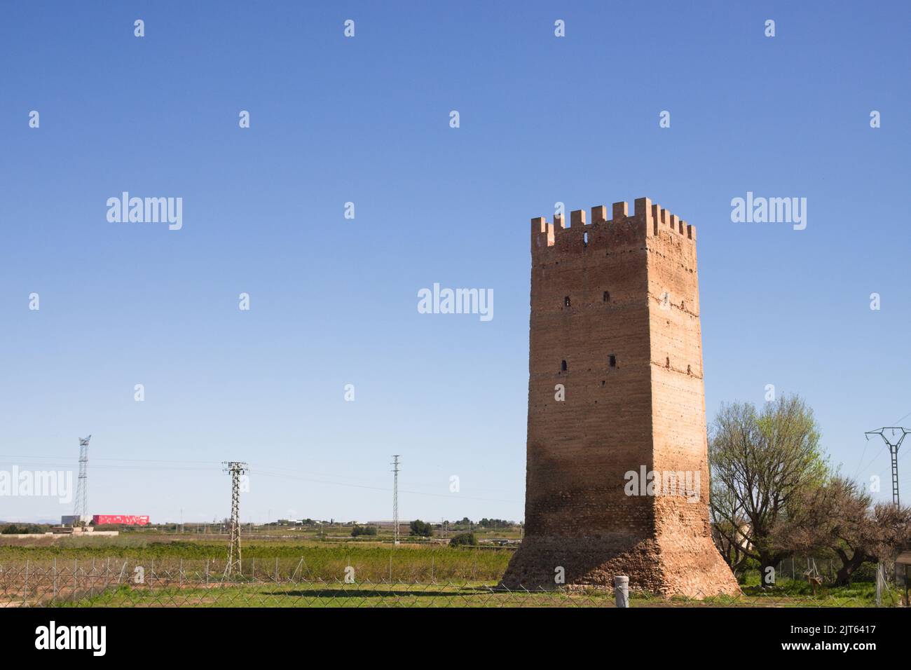 April, Benifaió, Valencia (Spain). Panoramic view of the Muza or Mussa tower of Arab origin from the 12th century near the city of Benifaió in Valenci Stock Photo