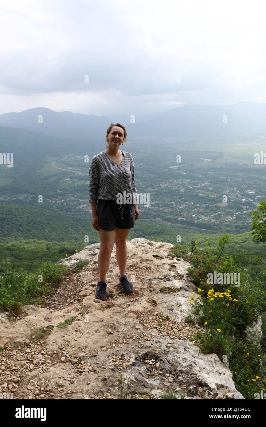 Women Ridge Woman posing on rock of Una-koz ridge in Caucasus, Adygea Stock Photo ...