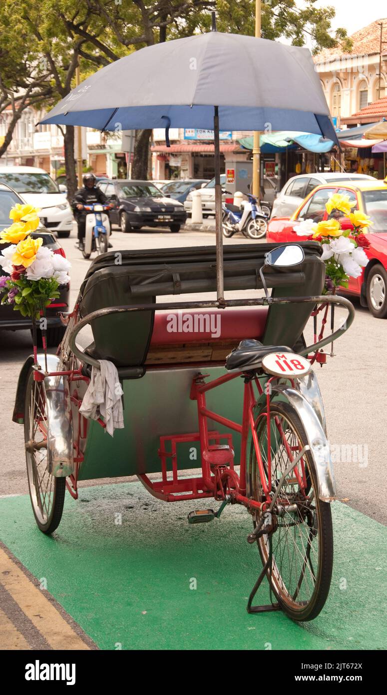Rickshaw, Penang, Malaysia, Asia. Rickshaws compete with all the other forms of
