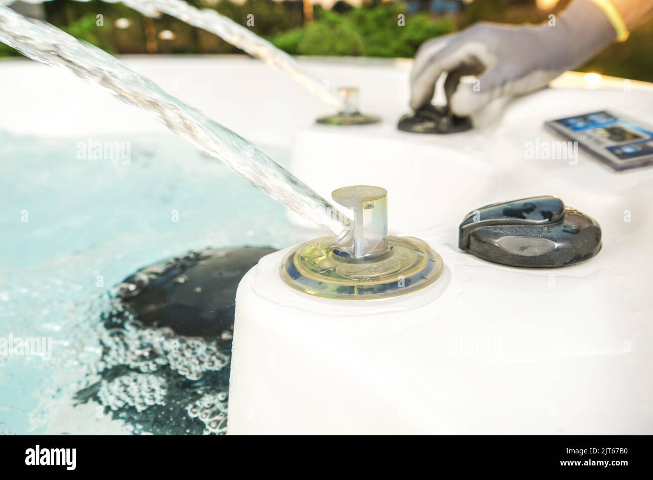 Worker Testing Garden Water SPA Features. Running Water Jets and