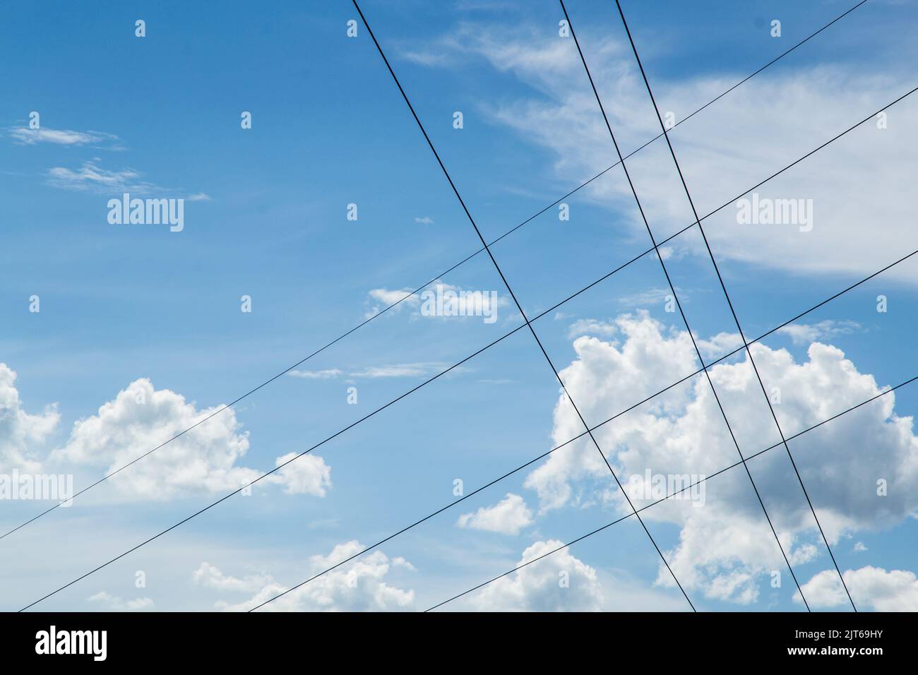 Blue sky and clouds with electric cables Stock Photo Alamy