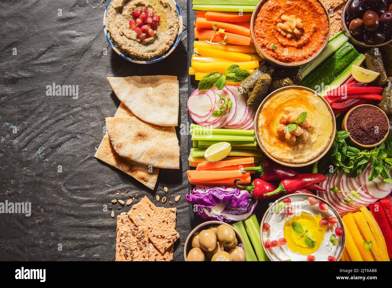 Arabic Cuisine; Middle Eastern meze platter with green falafel, pita