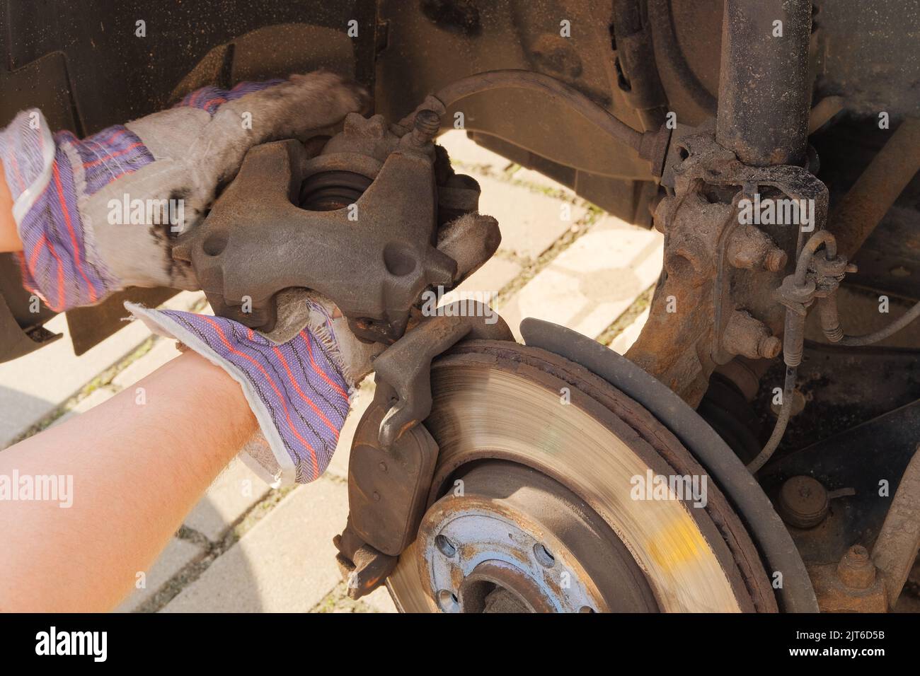 Car repair concept. Repair of a wheel on a passenger car. Check brake system of car. Stock Photo