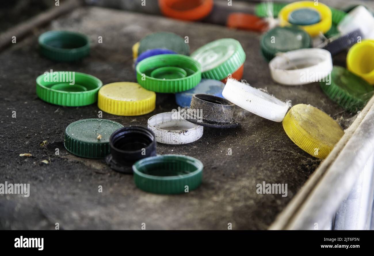 Dirty plastic caps in barrel, recycling and environment Stock Photo Alamy