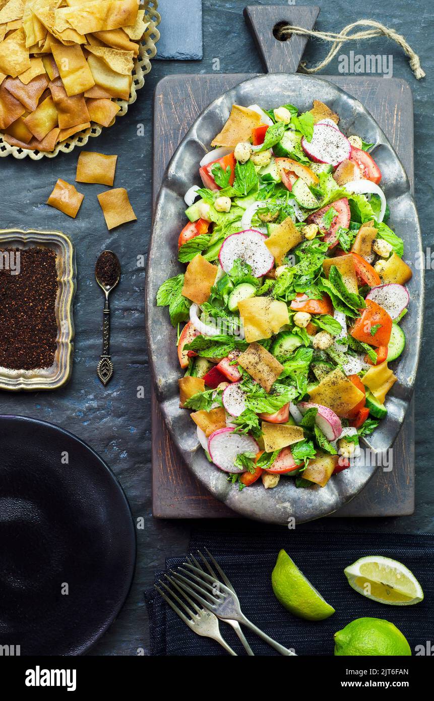Arabic cuisine; Traditional middle eastern salad. Delicious Fattoush salad with fresh tomato