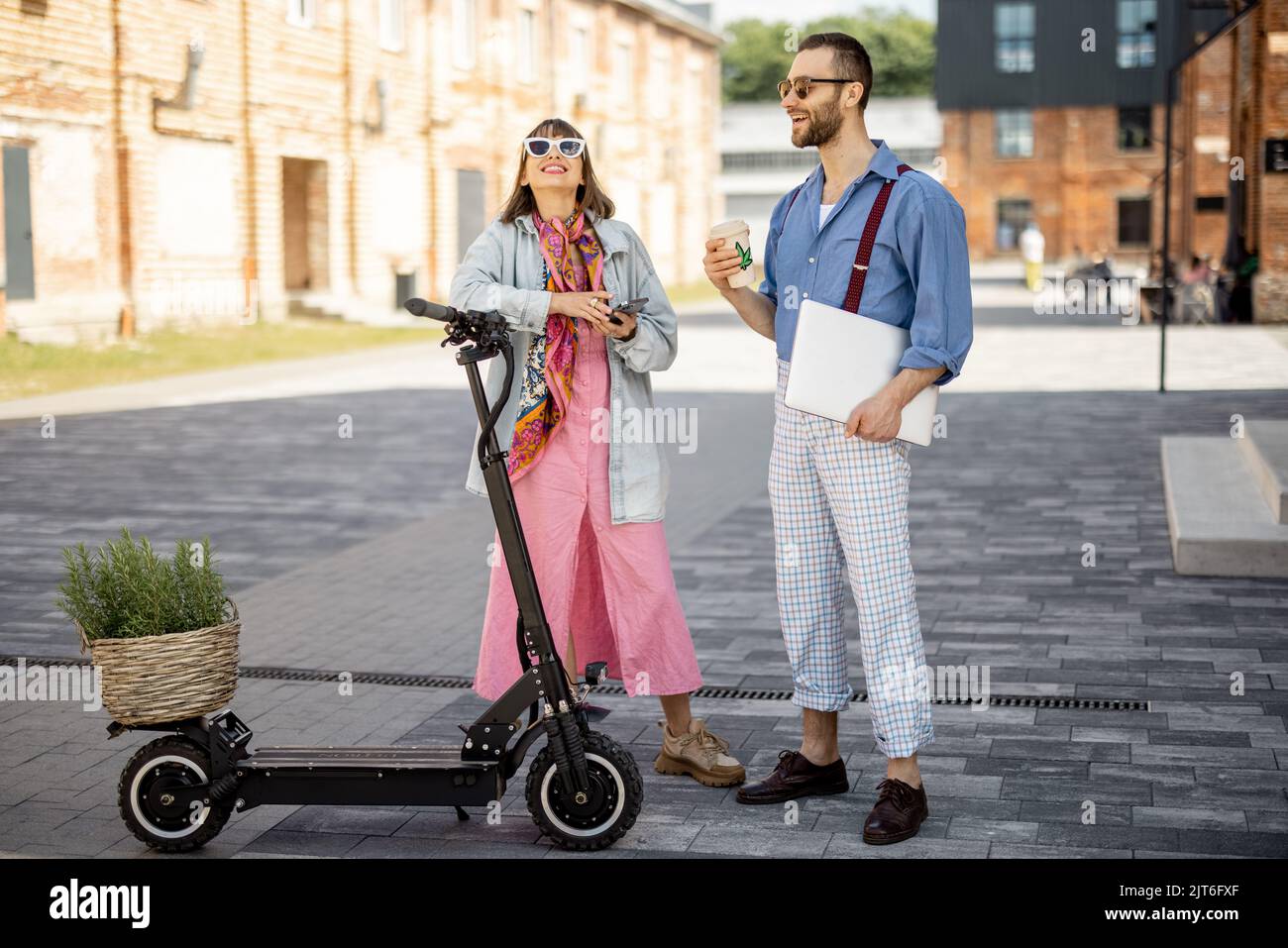 Stylish colleagues meet together outdoors Stock Photo
