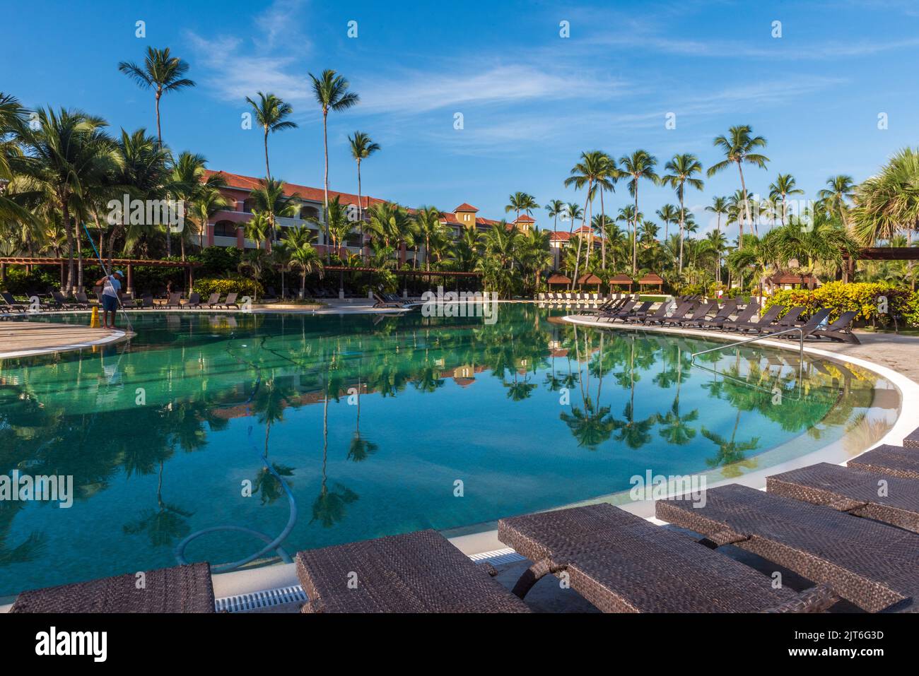 Punta Cana/ Dominican Republic - June 12 2016: Janitor cleans empty pool. Stock Photo