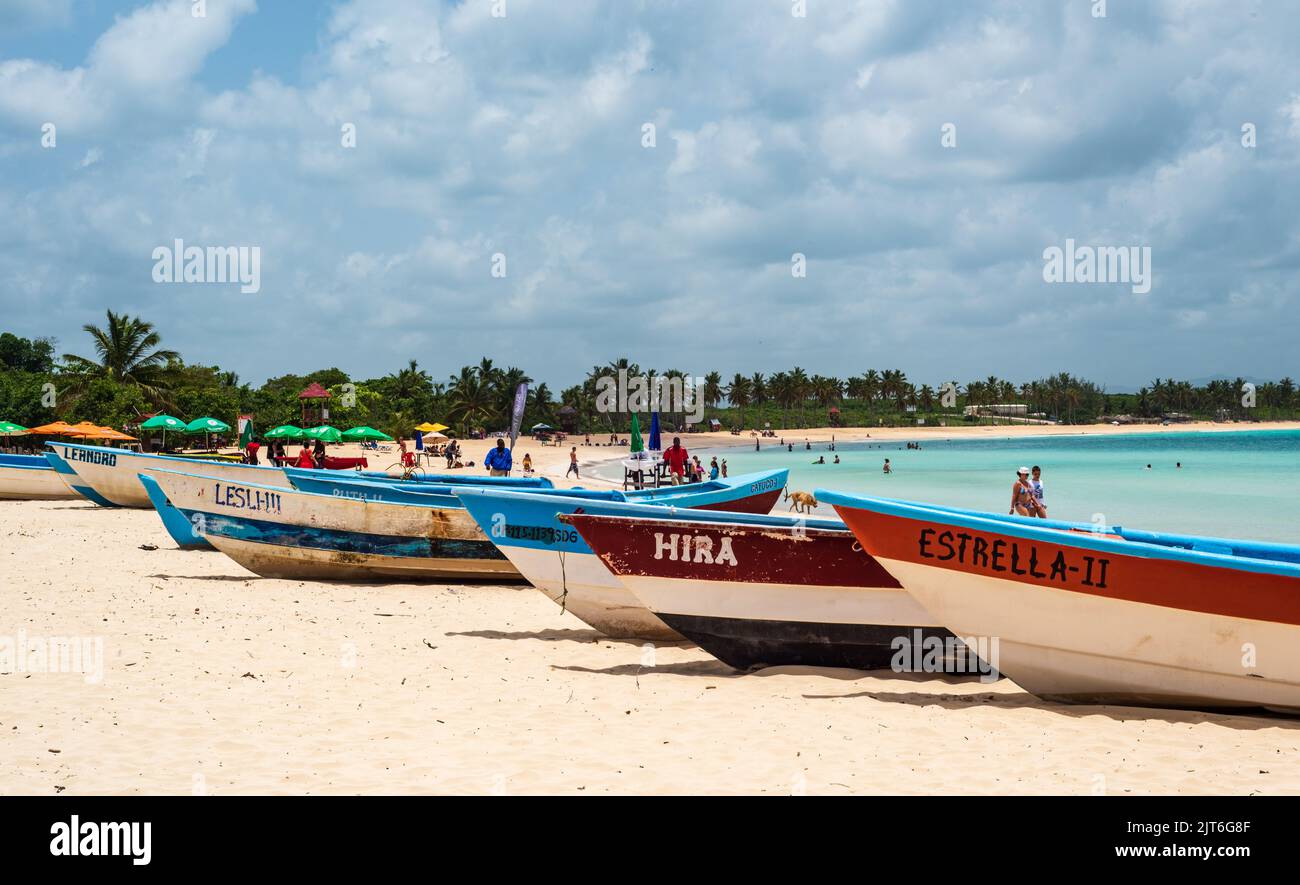 Punta Cana/ Dominican Republic - June 12 2016: Colorful rowboats on beach shoreline in Punta Cana, Dominican Republic. Stock Photo
