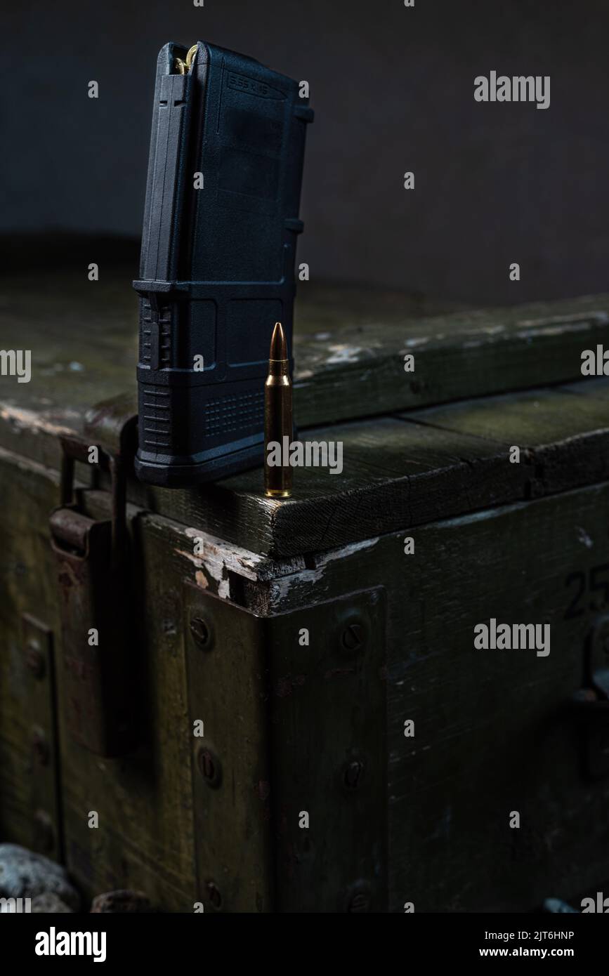 Magazine and cartridge on a military box. Cartridge for machine gun