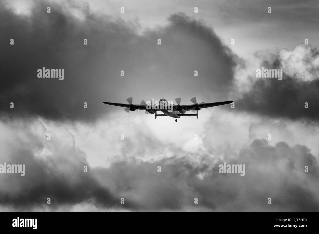 An Avro Lancaster flying in stormy skies Stock Photo