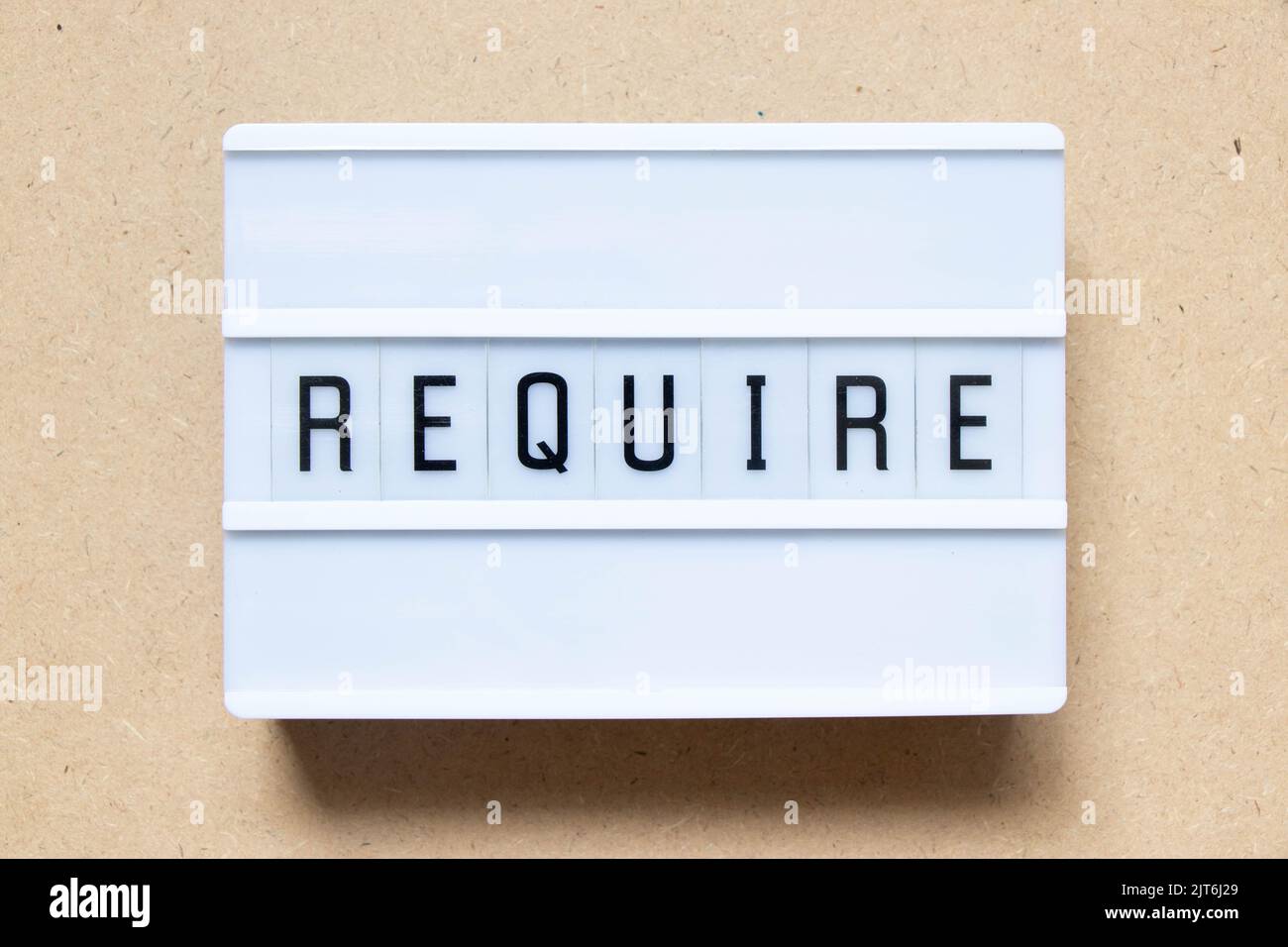 Lightbox with word require on wood background Stock Photo