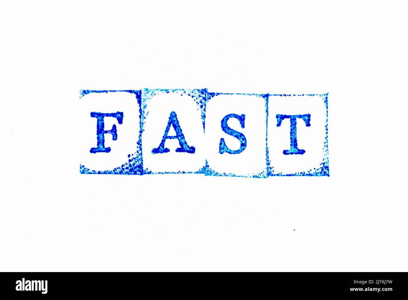 Blue color ink rubber stamp in word fast on white paper background Stock Photo