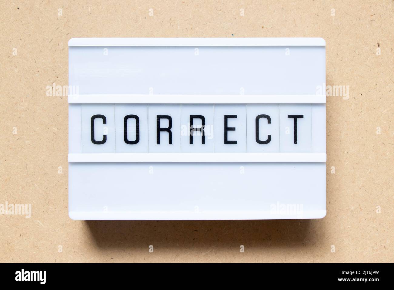 Lightbox with word correct on wood background Stock Photo