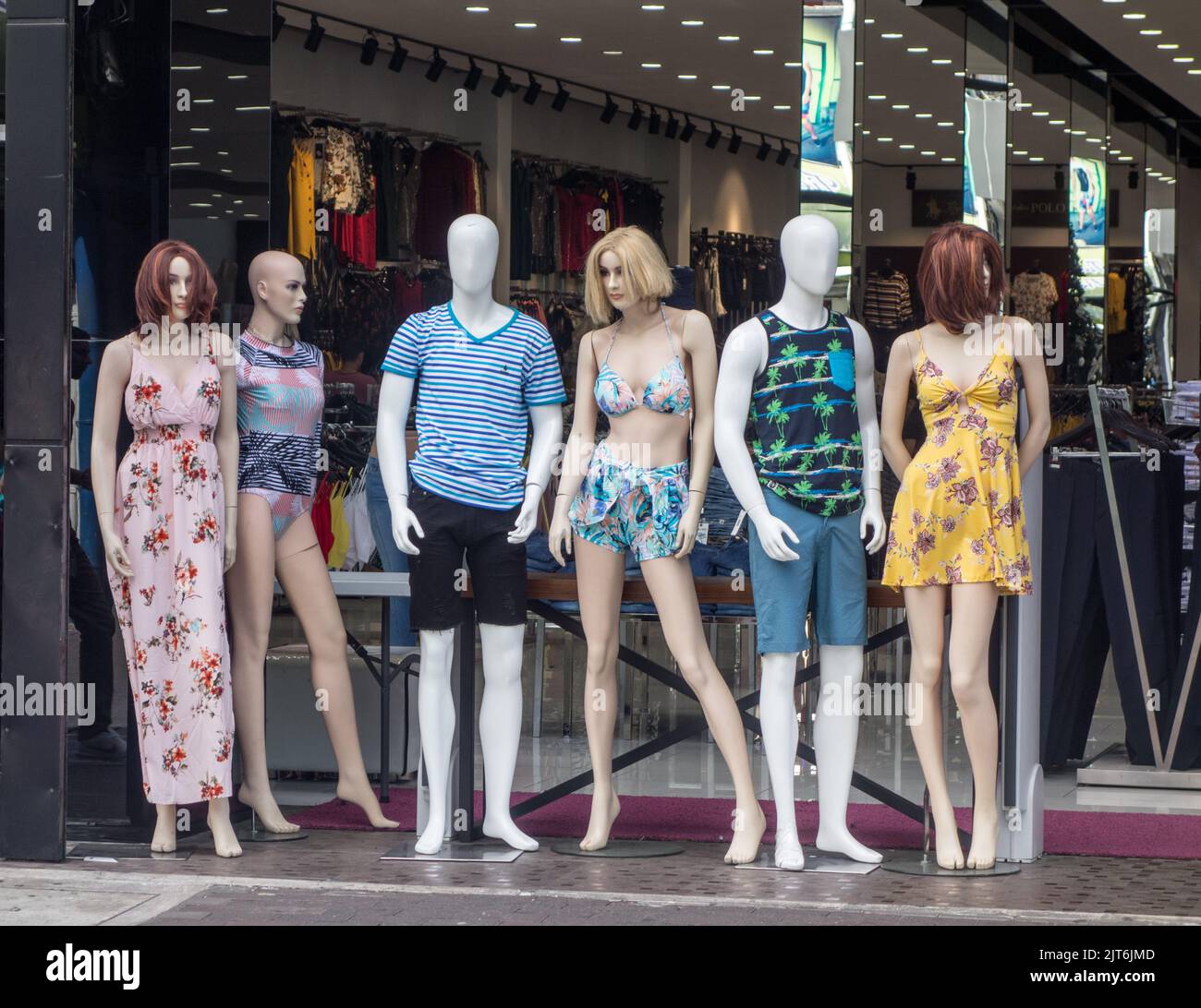 Mannequins displaying new clothes at a store front in San José, Costa Rica. Stock Photo