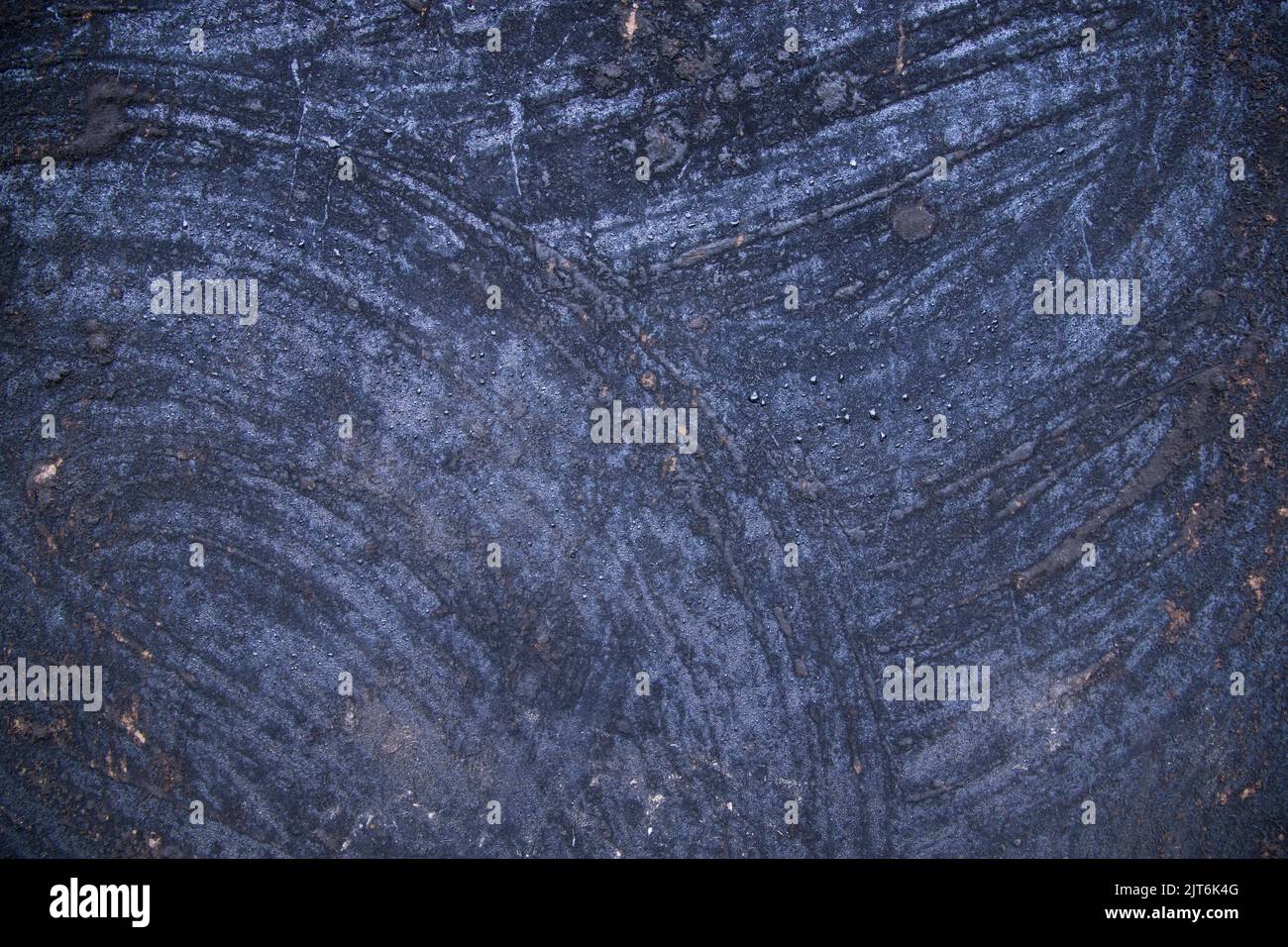 Old metal surface covered black ash  abstract background texture Stock Photo