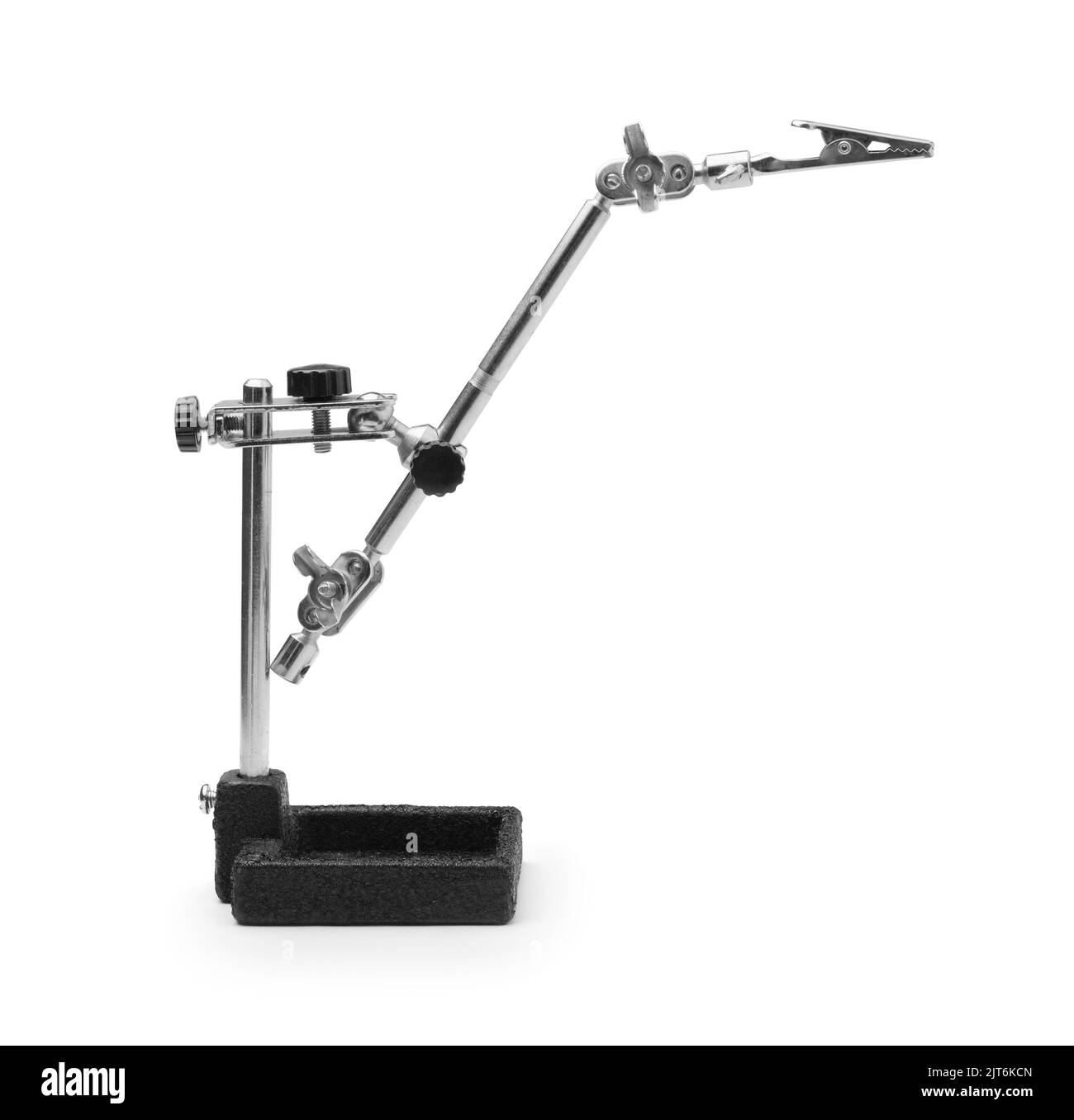 The old third hand device with clamps for holding small for soldering