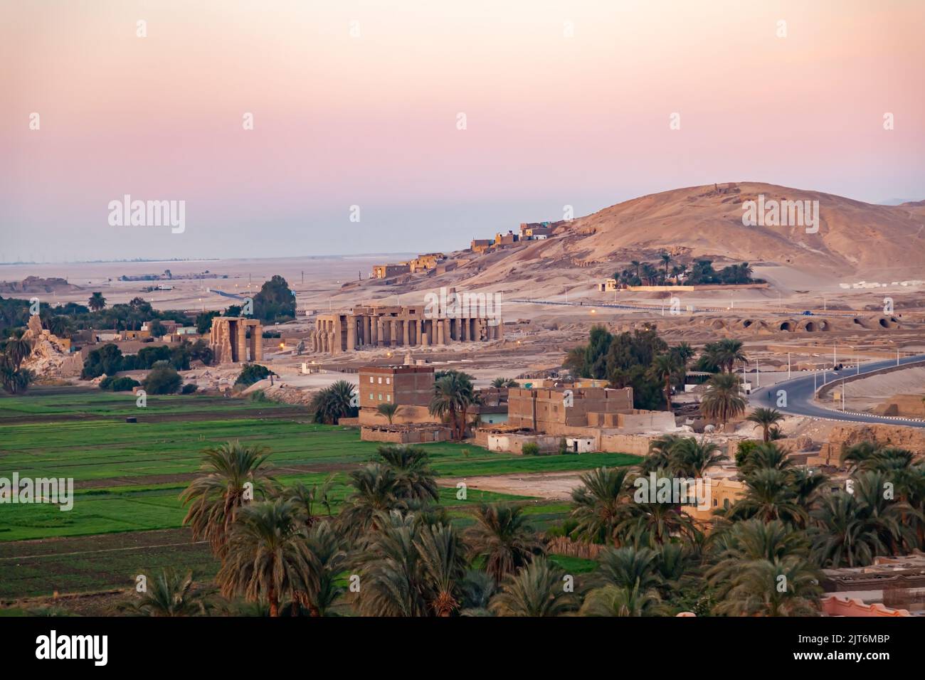 Landscape of Valley of The Kings in the morning at Theban Necropolis with The Temple of Ramesseum for Pharaoh Ramses II and the green crop of the vill Stock Photo