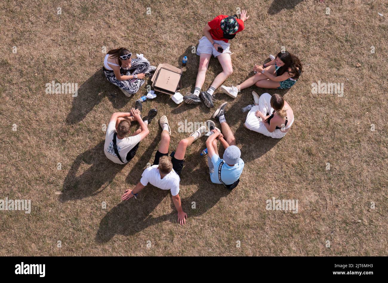 Revelers enjoy the sun and hot weather during the Leeds Festival 2022