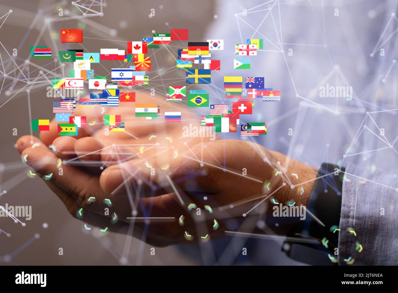 World Connection With Flags A 3D rendering of international flags floating above a hand for global ...
