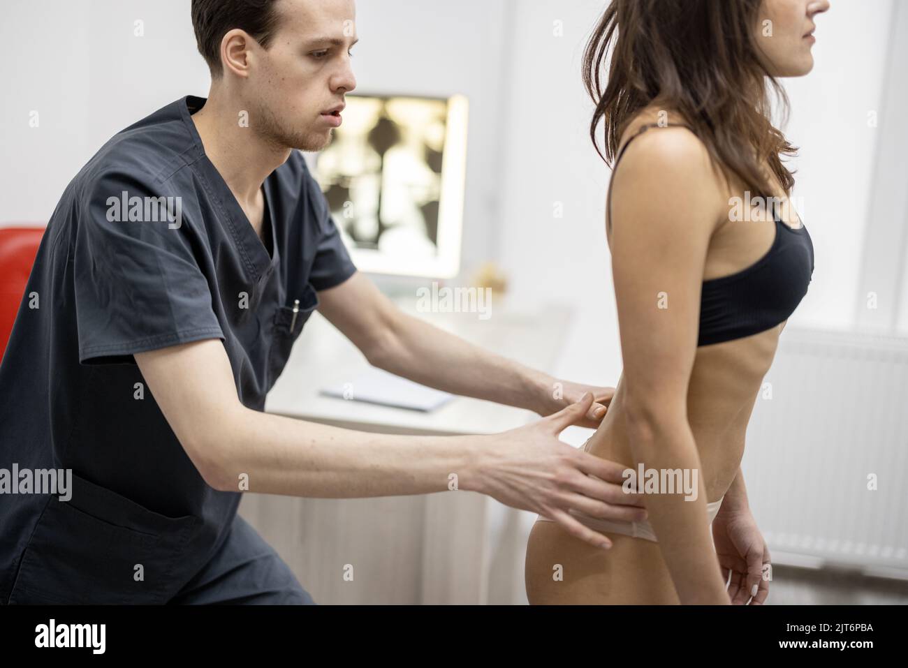 Woman on examination by physical therapist Stock Photo