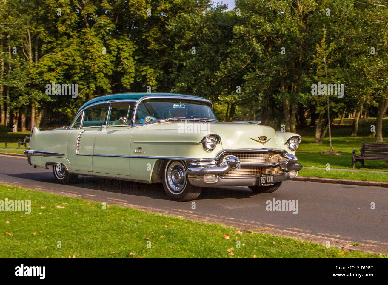 1956 50s fifties Green American 1956 Cadillac De Ville Auto 6000cc Petrol; arriving at The annual Stanley Park Classic Car Show in the Italian Gardens. Stanley Park classics yesteryear Motor Show Hosted By Blackpool Vintage Vehicle Preservation Group, UK. Stock Photo