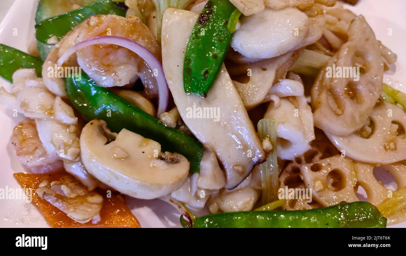Chinese cuisine - Lotus root stir fry with shrimp and mushroom.  Horizontal top view Stock Photo