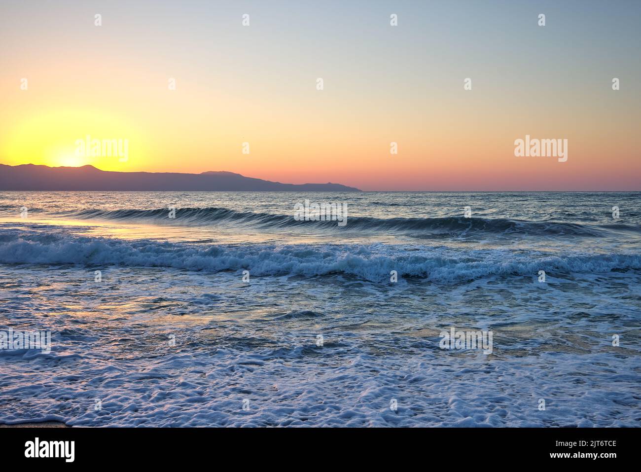 Beautiful sea and waves at sunset time in Chania Crete - Greece Stock Photo
