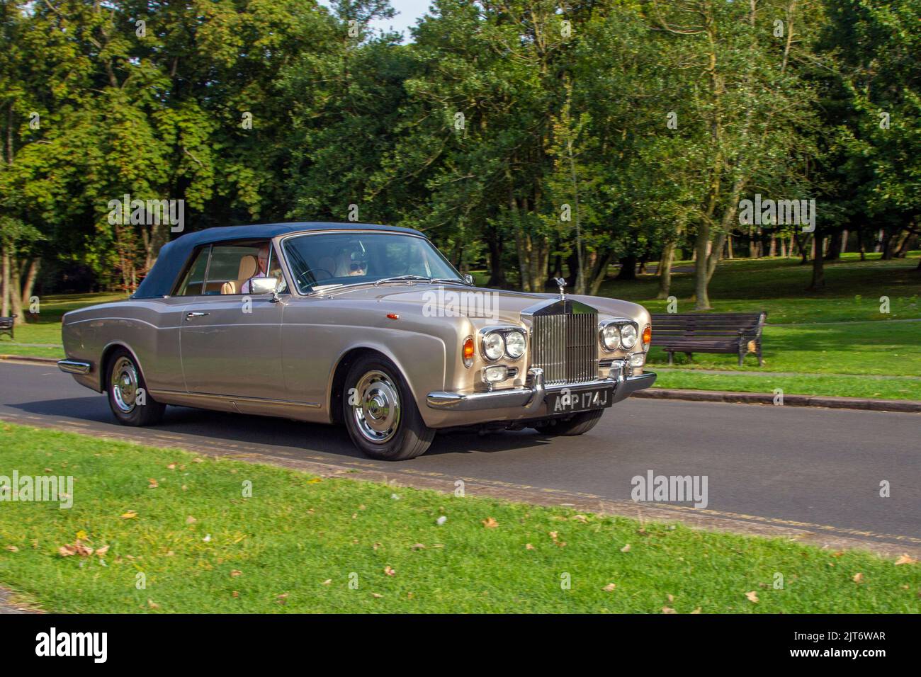 1970 70s seventies Gold British ROLLS ROYCE 6750cc petrol luxury saloon; arriving at the annual Stanley Park Classic Car Show in the Italian Gardens. Stanley Park classics yesteryear Motor Show Hosted By Blackpool Vintage Vehicle Preservation Group, UK. Stock Photo