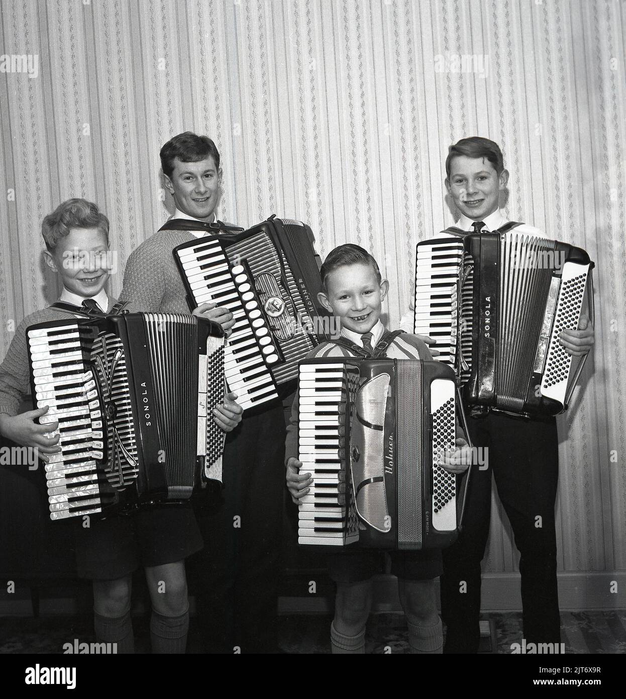 1965, historical, the winners, Scottish Accordion Champions at the Perth Accordion & Fiddle Festival, Perth Scotland, UK, standing for a photo with their musical instruments, piano accordions, so-named as they have a piano-style musical keyboards. One of the boys is holding a Sonola 120 Bass accordion, made in the Italian town of Castalfidardo at the Sonola factory, while another has a Hohner model, an accordion made in the German town of Trossingen. The first Accordion & Fiddle Festival was held in the Scottish town of Perth in 1950. Stock Photo