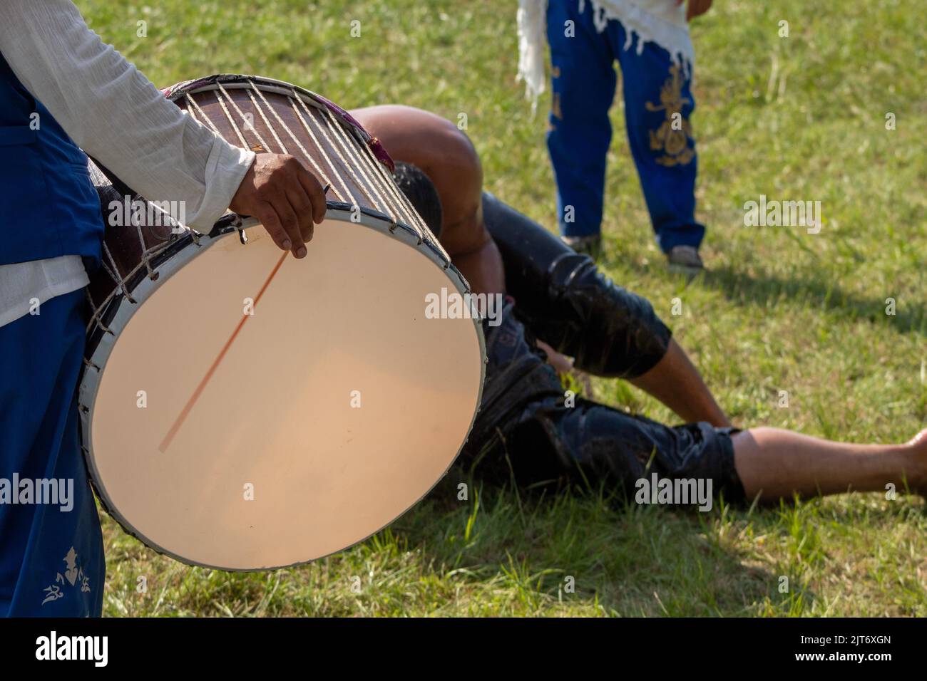 Bursa, Turkey - August 2022: Drummers in their traditional costumes are playing drums at the traditional Turkish oil wrestling festival. Selective focus. Stock Photo