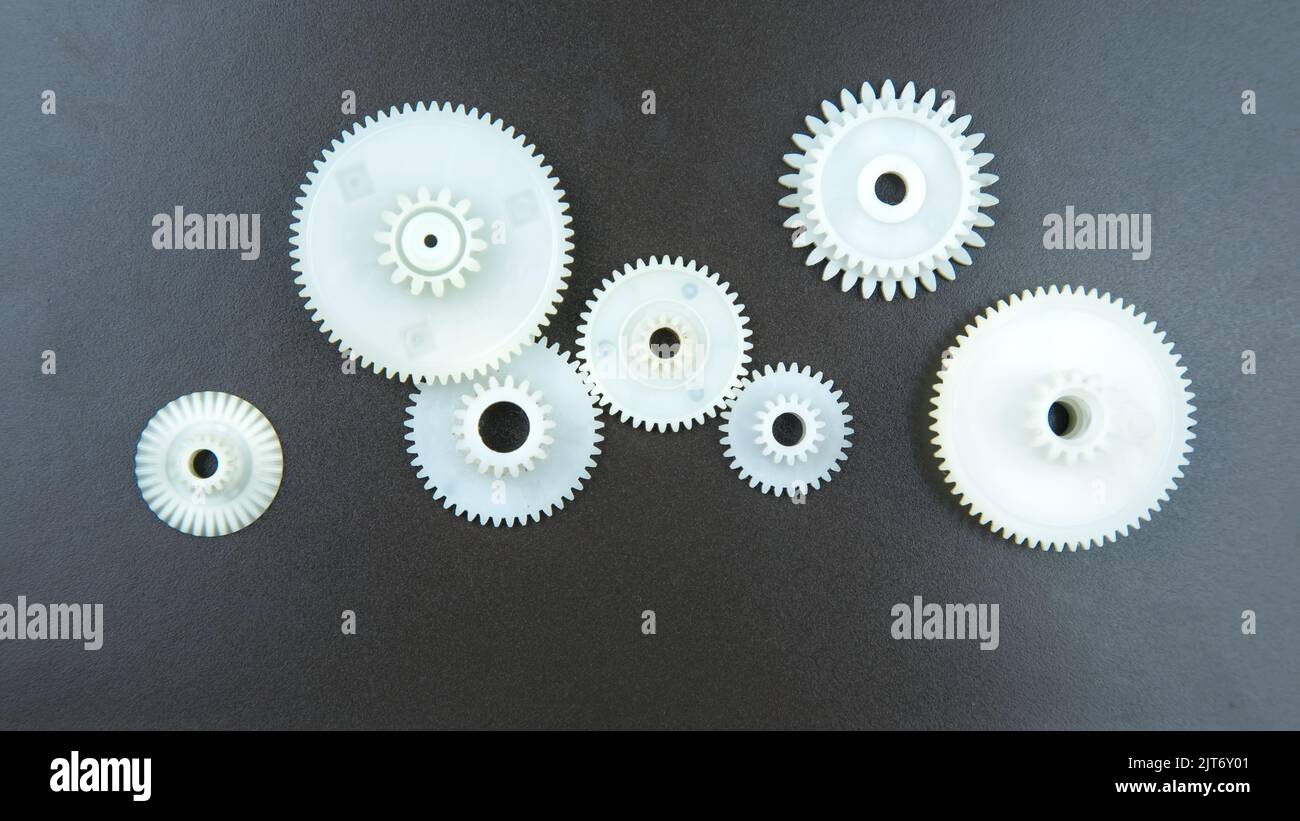 inkjet printer paper feeder mechanical drive. four external spur gear  wheels with different gear ratios. reducer of plastic cogwheels. with  clipping p Stock Photo - Alamy