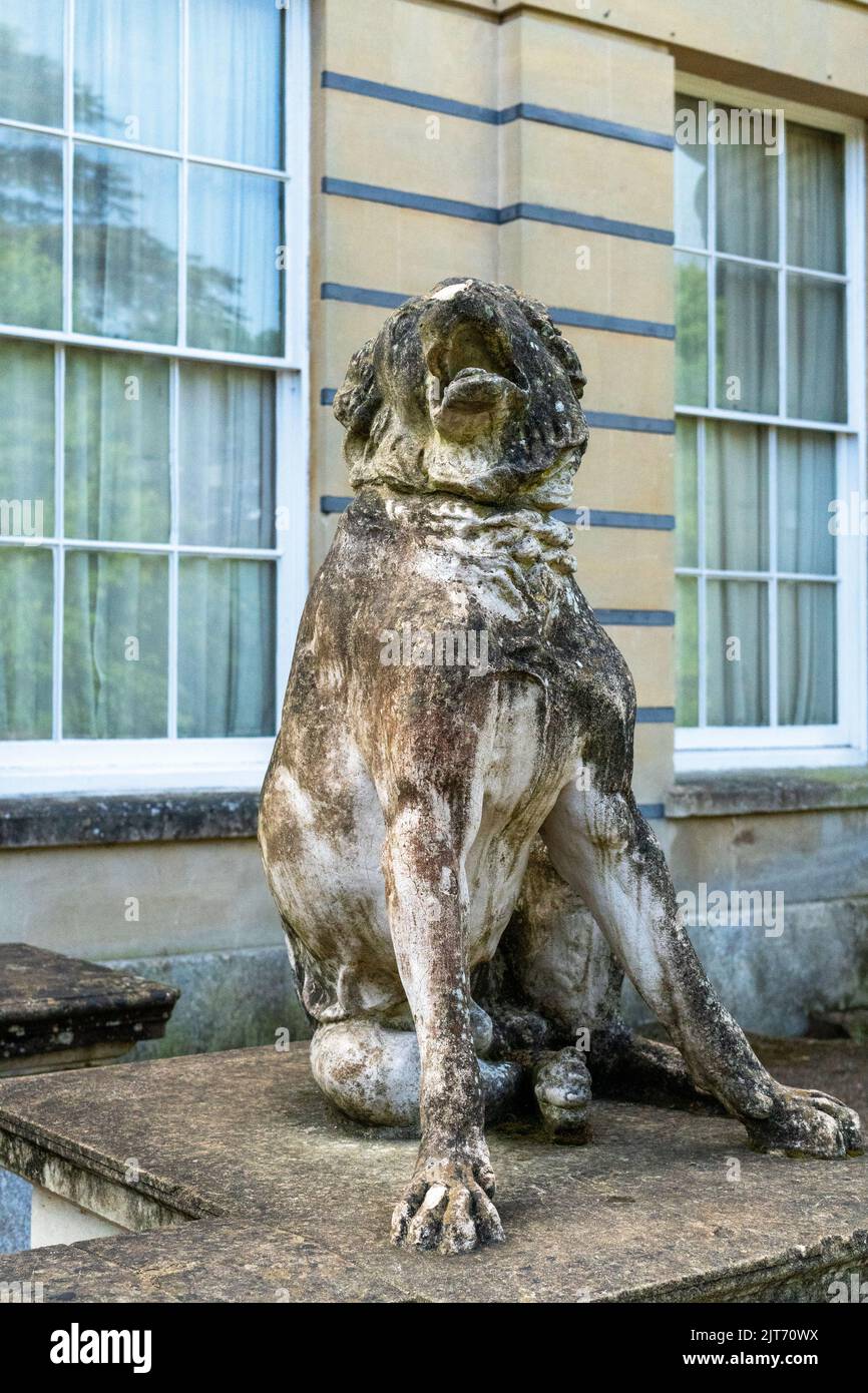 A closeup of statue of a barking dog in Blaise castle estate Stock Photo Alamy