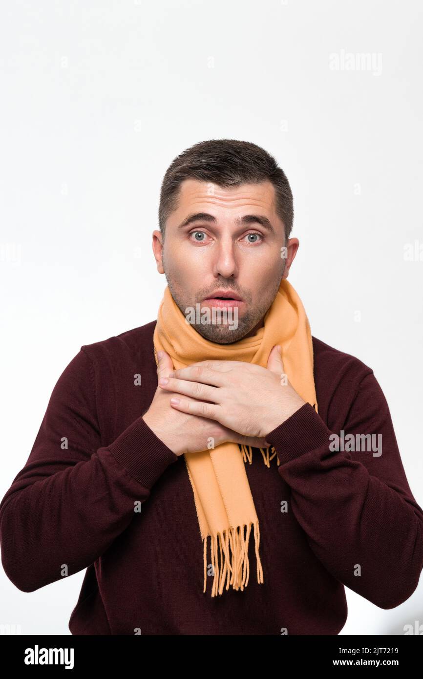 A man suffers from a sore throat, a man wrapped his throat with a scarf
