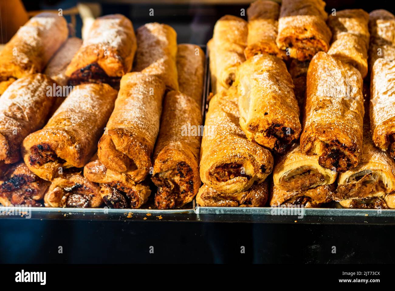 Baked pastry in a bakery window display Stock Photo - Alamy