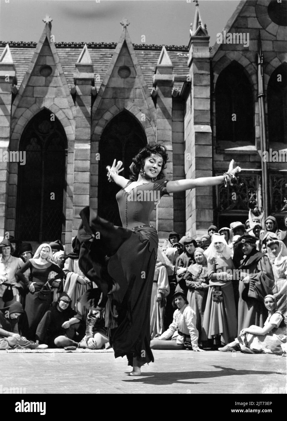 GINA LOLLOBRIGIDA as Esmeralda dancing in THE HUNCHBACK OF NOTRE DAME / NOTRE DAME DE PARIS 1956 director JEAN DELANNOY novel Victor Hugo adaptation / dialogue Jean Aurenche and Jacques Prevert music Georges Auric costume design Georges Benda production design Rene Renoux choreographer Leonid Massine producers Raymond and Robert Hakim France - Italy co-production Paris Film Productions / Panitalia Stock Photo