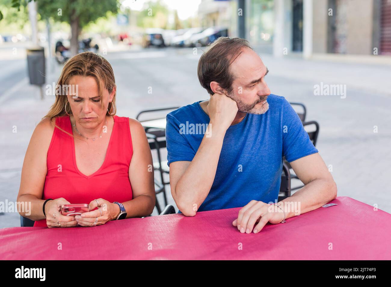 Hispanic angry mature couple. unhappy relationship. Communication problems in a restaurant Stock